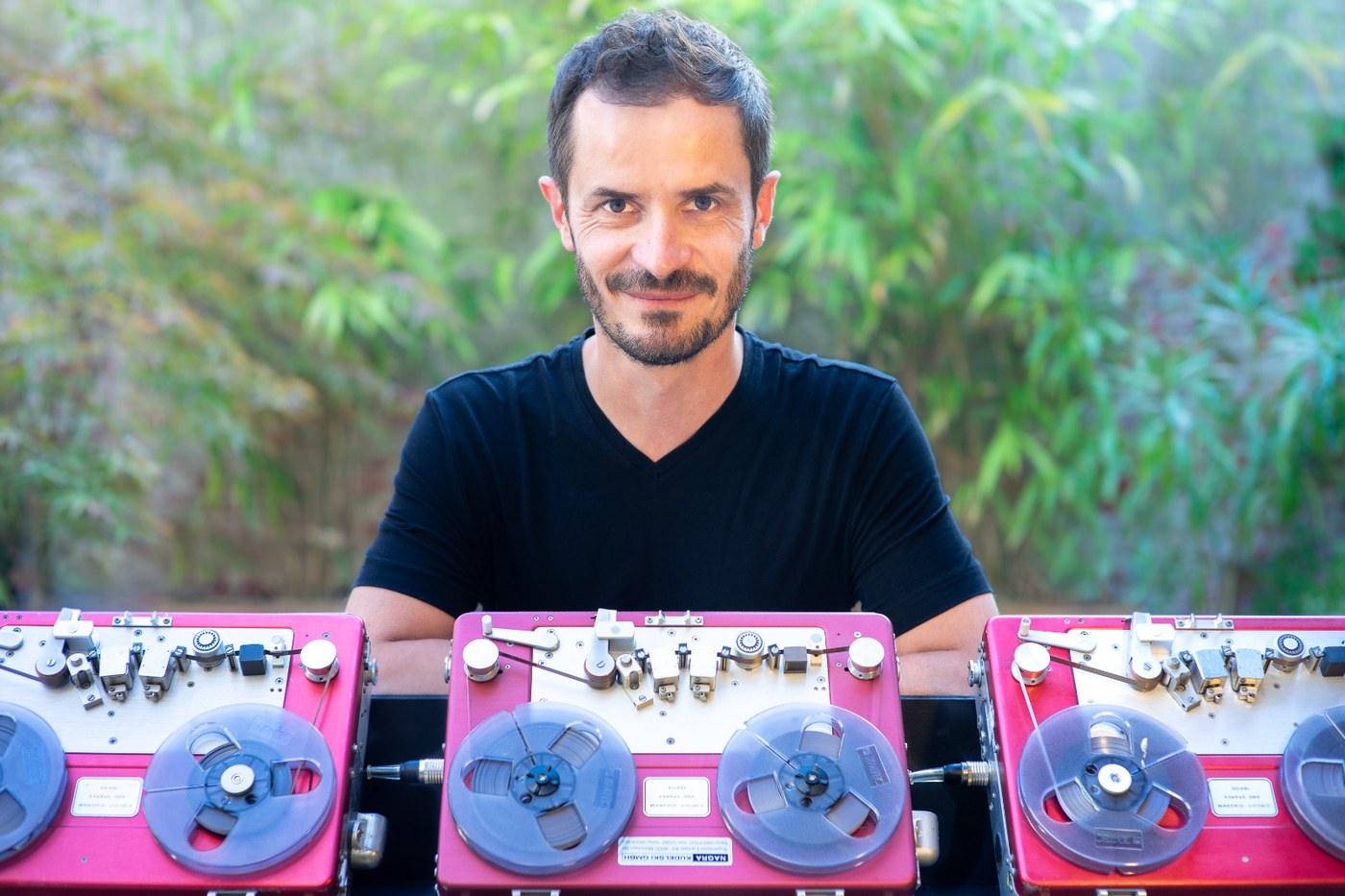 Mastering engineer with reel-to-reel tape machines
